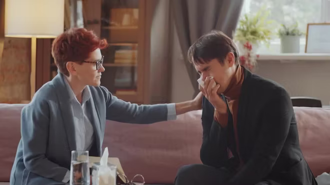 man-crying-on-therapy-session-with-psychologist-2326373-high_0010