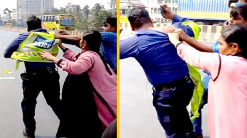 মহাসড়কে ট্রাফিক পুলিশকে পেটালেন নারী